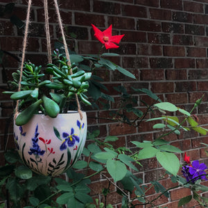 hand painted porcelain hanging pot in the garden